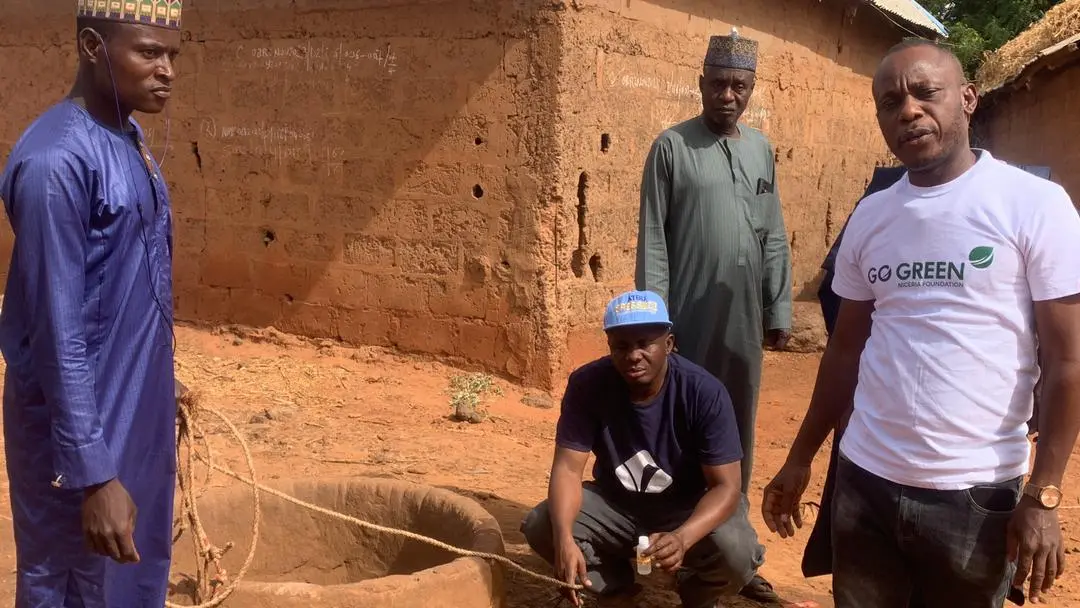 Volunteers collaborating on a Go Green Nigeria Foundation project