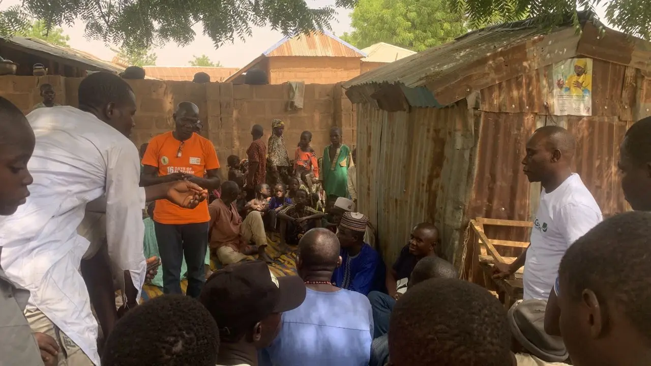 Go Green Nigeria Foundation staff speaking with community members