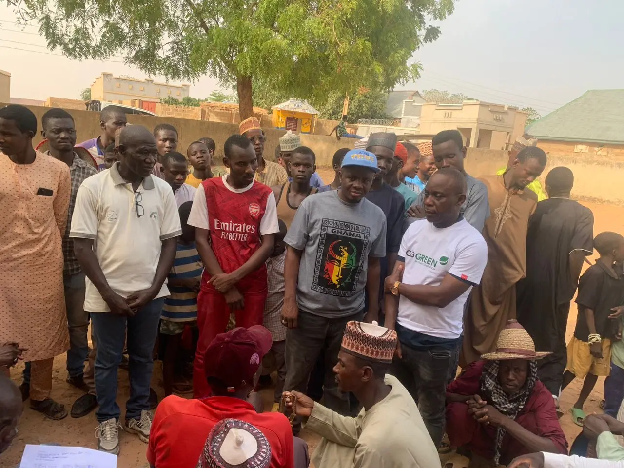 Foundation volunteers standing with residents during a community visit