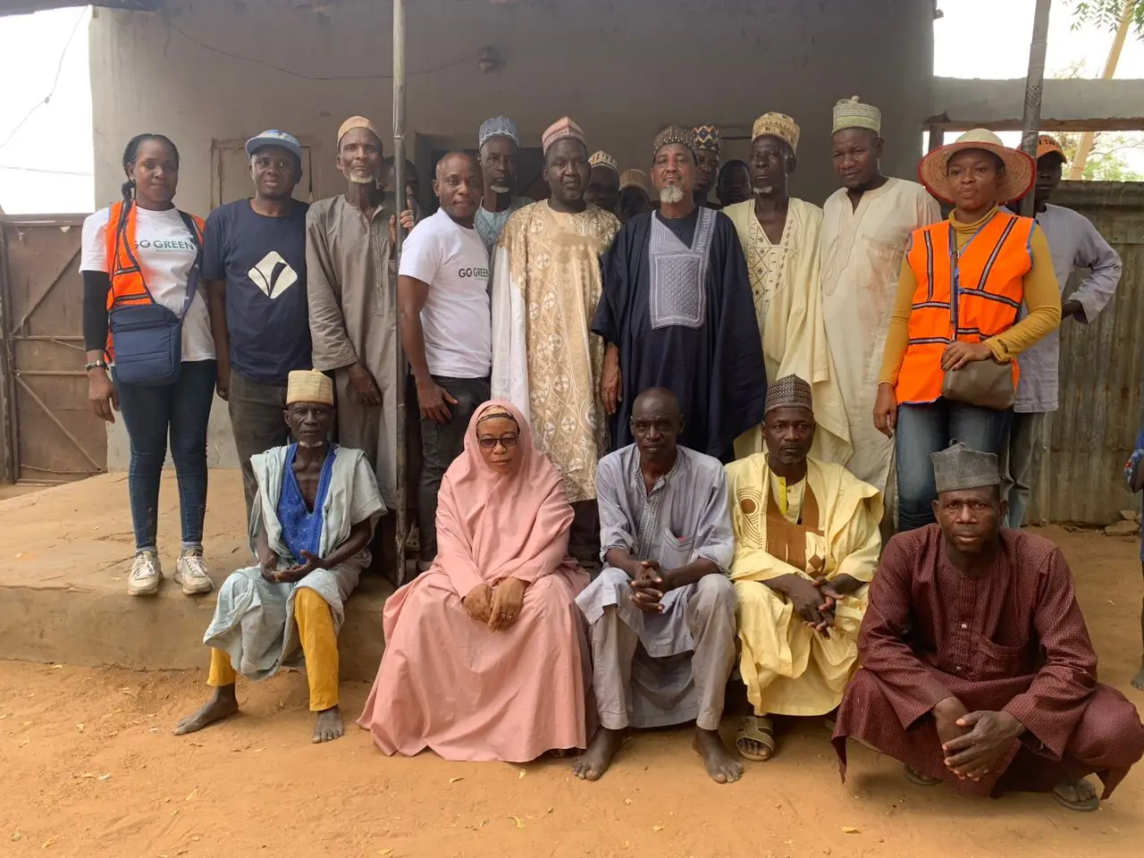 Foundation volunteers and community elders posing for a group photo
